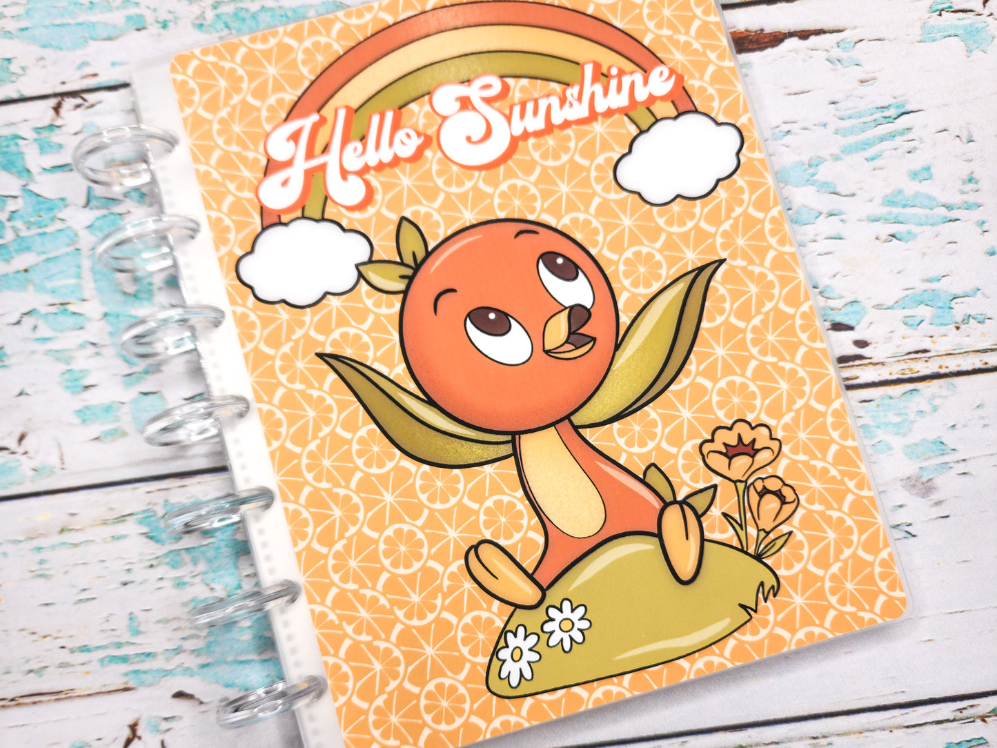 a spiral notebook with a picture of a bird on it