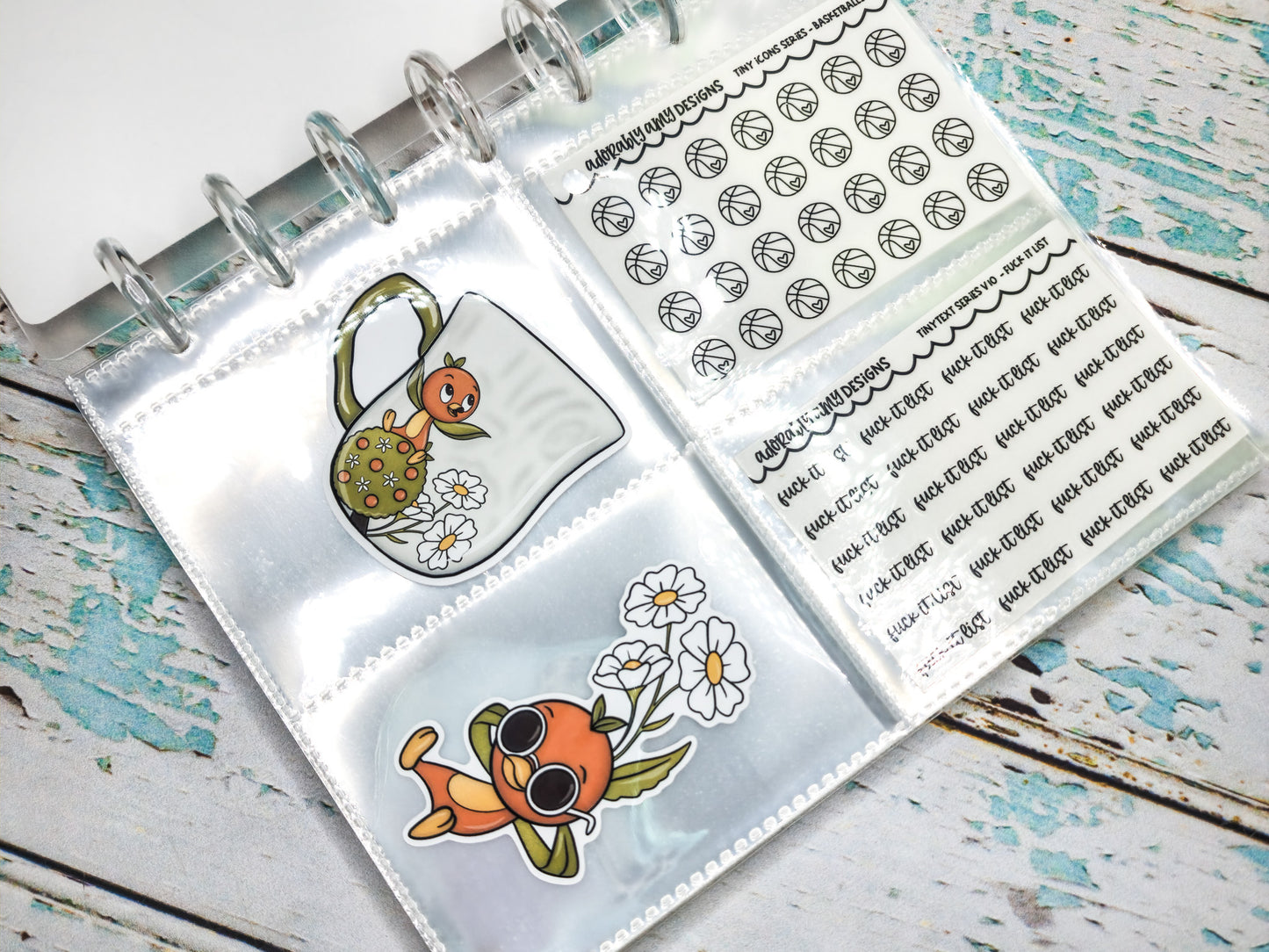 a planner with stickers on it sitting on a table